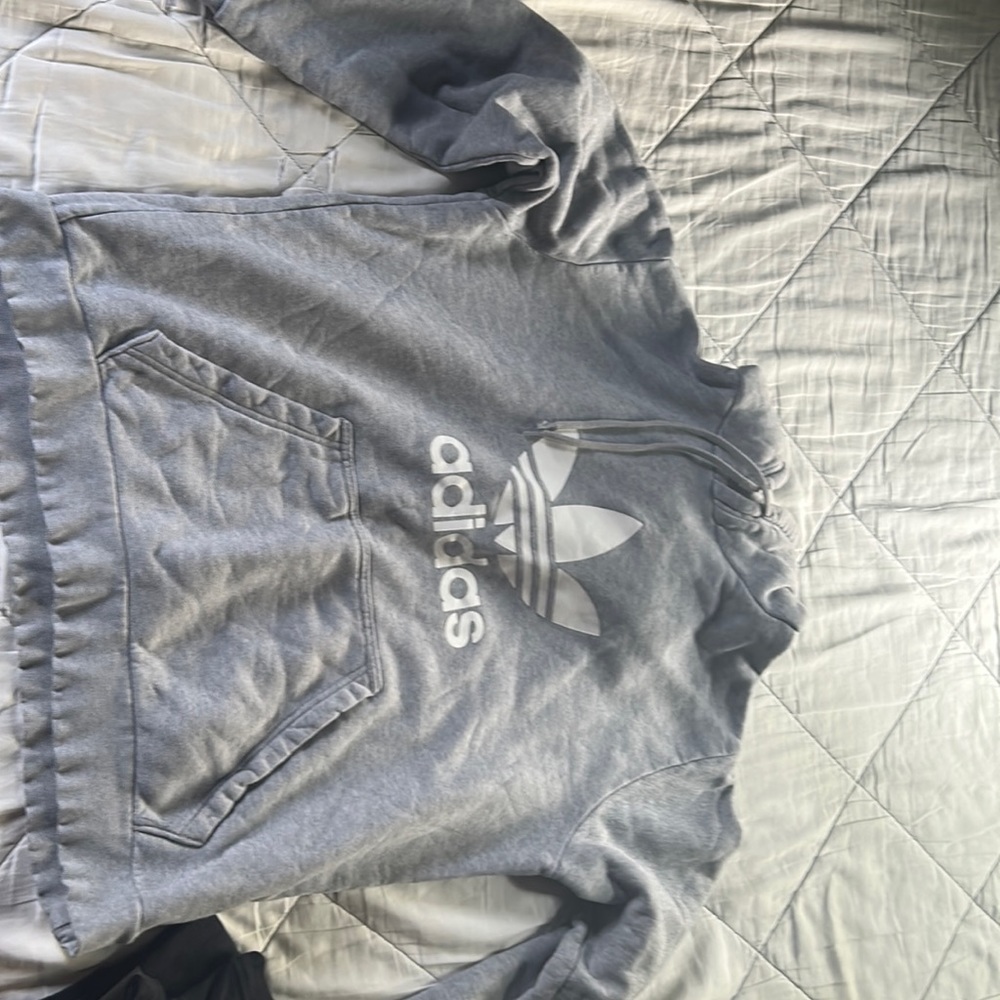 Adidas men’s sweatshirt in between a small and medium